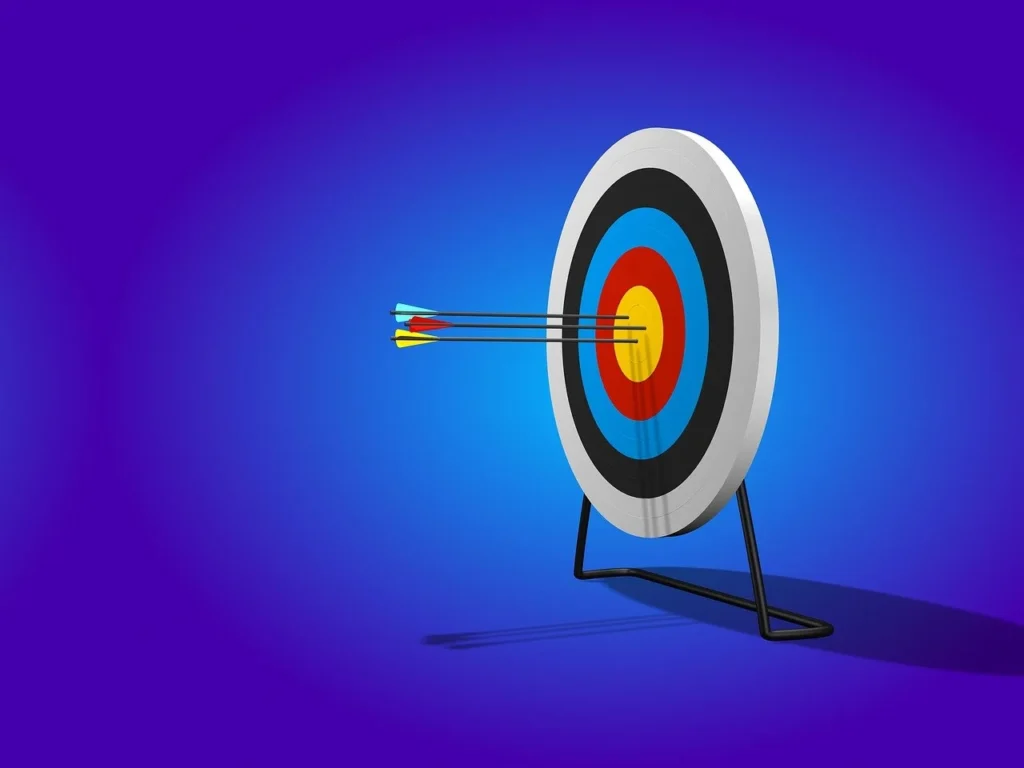 Arrow hitting the bullseye of a target